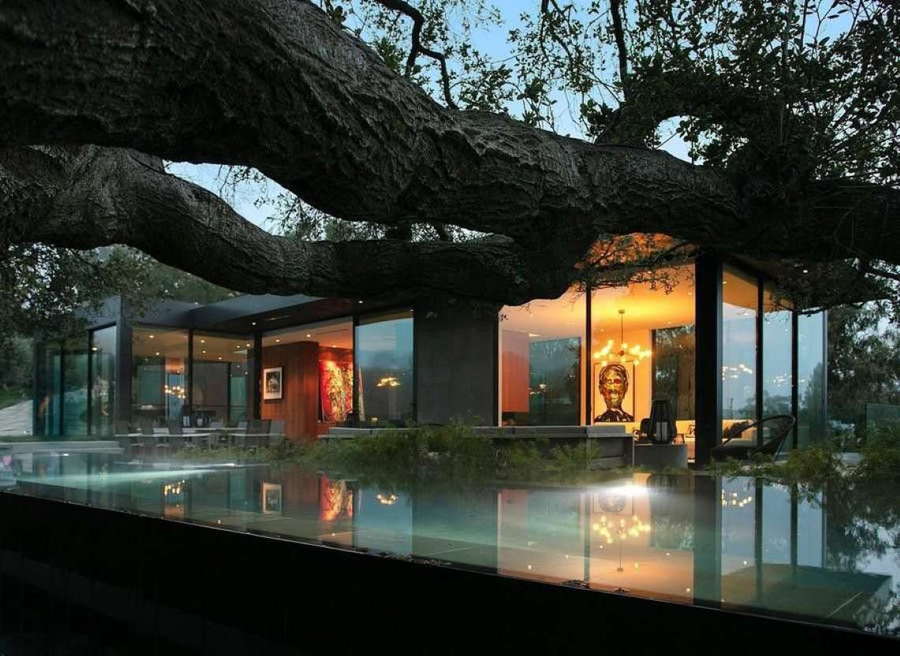 Exterior evening shot of film producer Ken Kao's sleek, glass-heavy Beverly Hills mansion. 