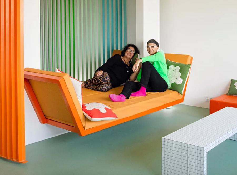 Matali Crasset and Michéle Monory relax in Monory's newly renovated rainbow apartment.