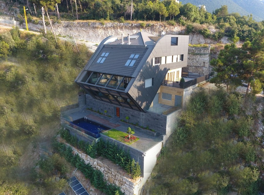 The CH730 Villa in Lebanon appears to slide off the cliffside it's built on.