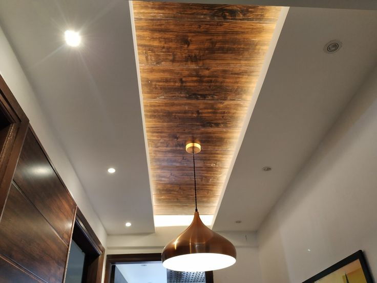 Unconventional gypsum ceiling pairs with wood for beautiful results.