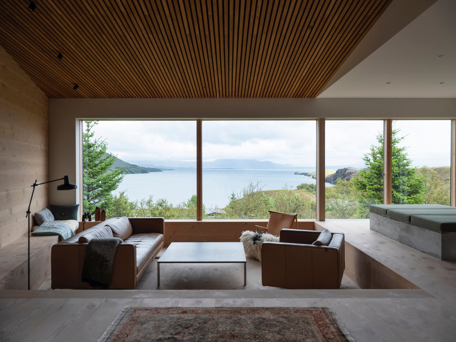 Sunken living area in the Holiday home by Þingvallavatn offers some of the property's most breathtaking views.