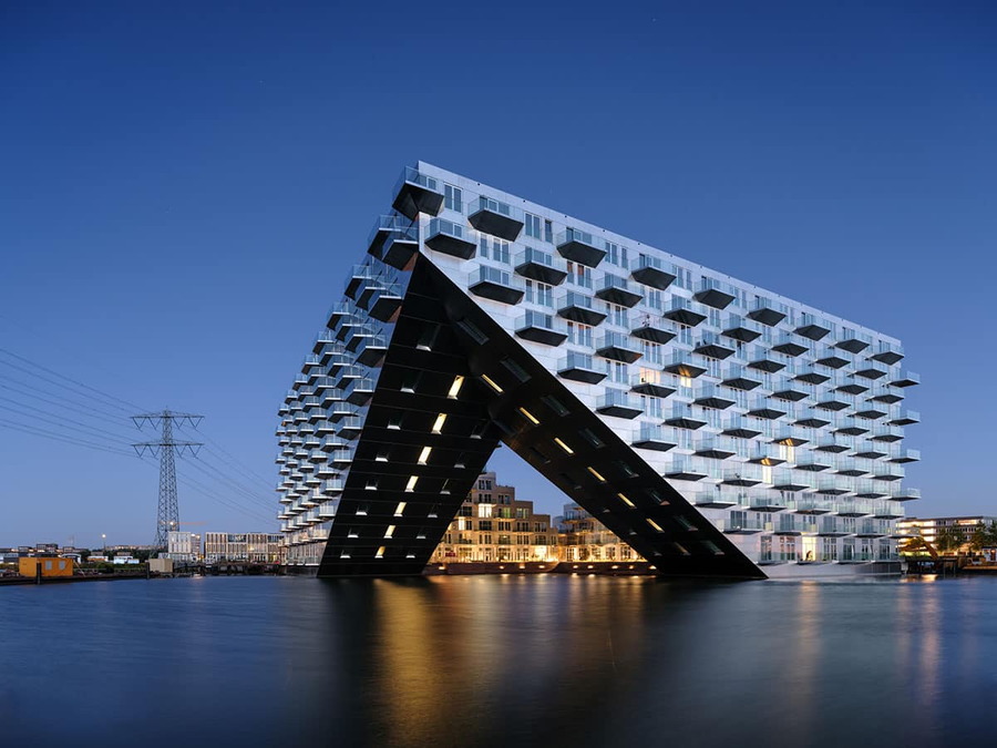 Ship-like Sluishuis Apartment Complex in Amsterdam, designed by BIG and Barcode Architects.