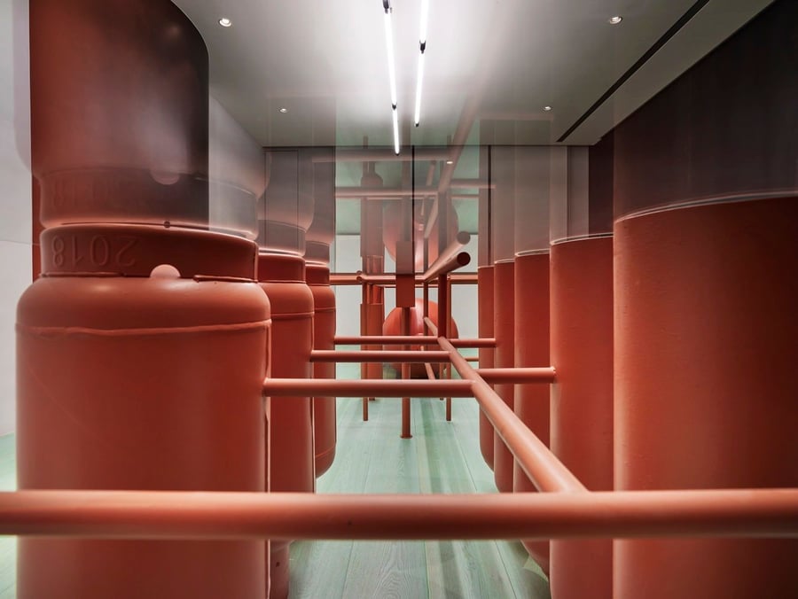 Orange gas tanks are the central motif of Wavefrom Studio's design for the Ideal Gas Lab.