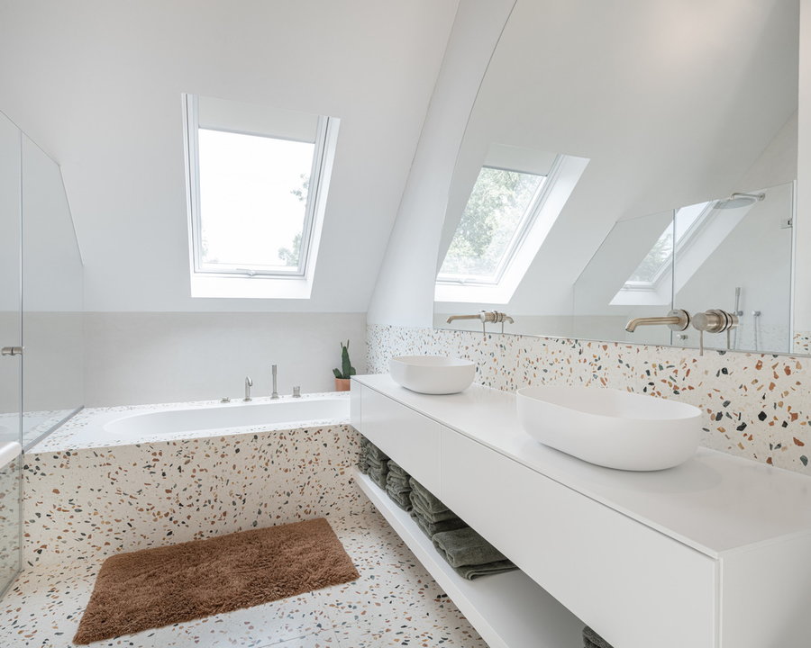 Renovated bathroom space inside the Old & New Belgian farmhouse offers lots of natural light.