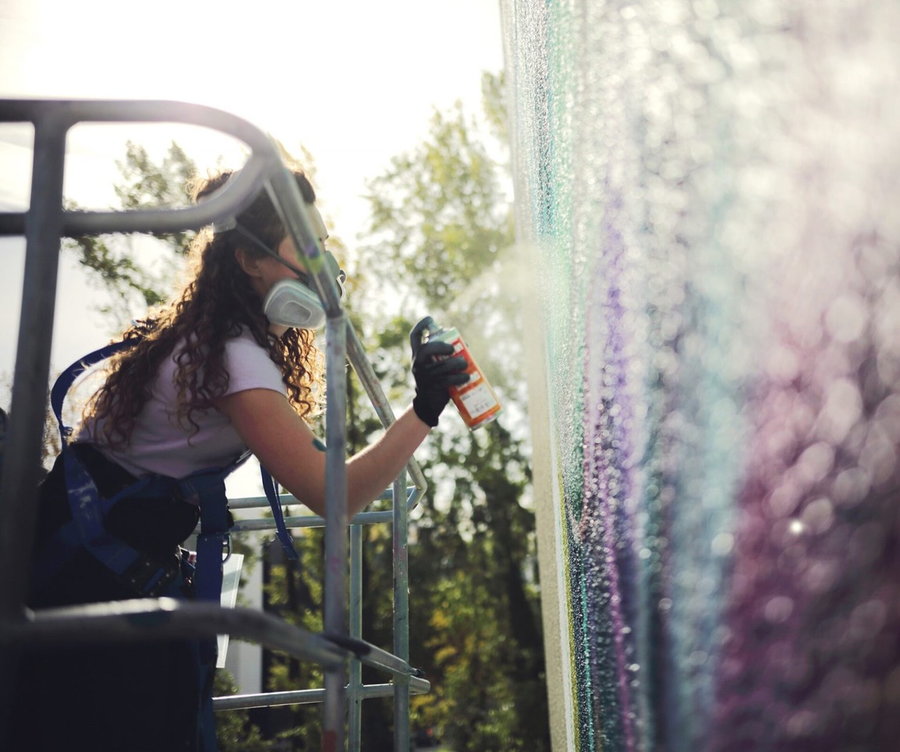 London-based street artist Rosie Woods hard at work on one of her gorgeous murals. 