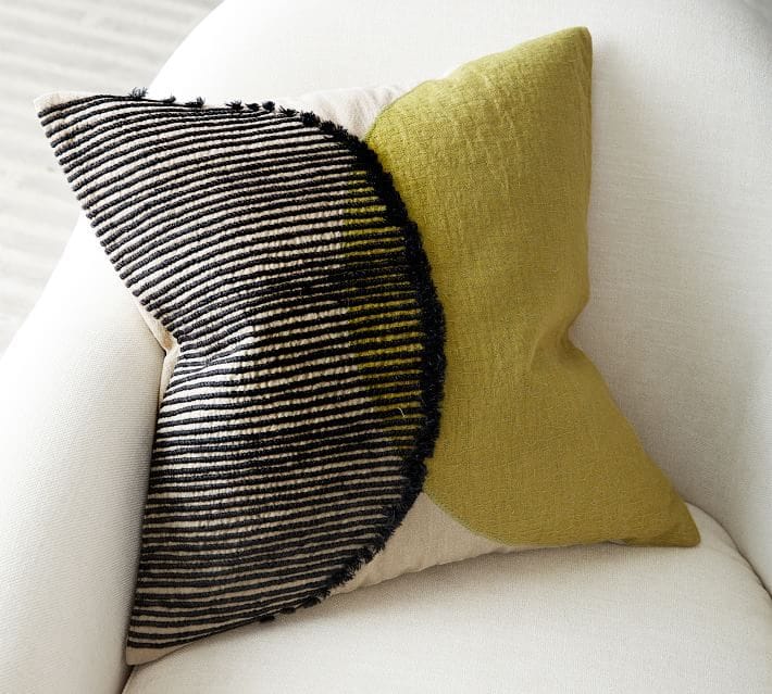 BADG Unity Embroidered Pillow featured in Pottery Barn's new collection with the Black Artists + Designers Guild. 