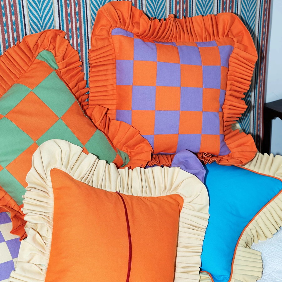 Colorful handmade throw pillows by 28-year-old Gambian immigrant Paboy Bojang. 