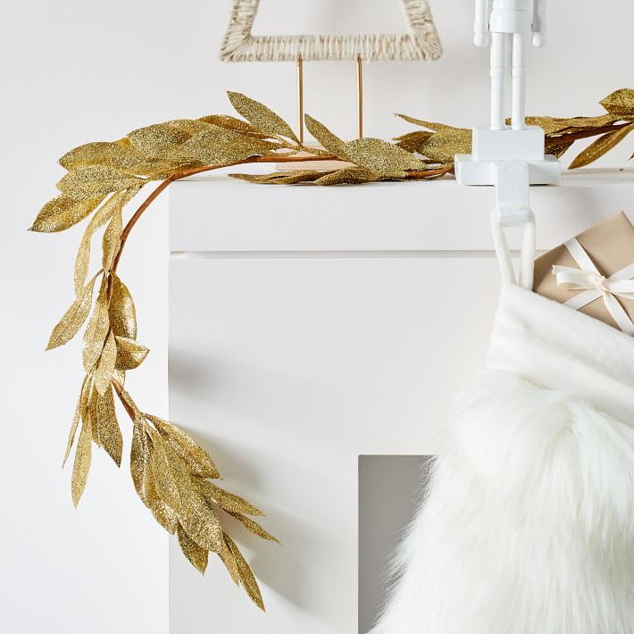 Elegant leaf kraft and glitter garland featured in West Elm's 2020 holiday decor collection.