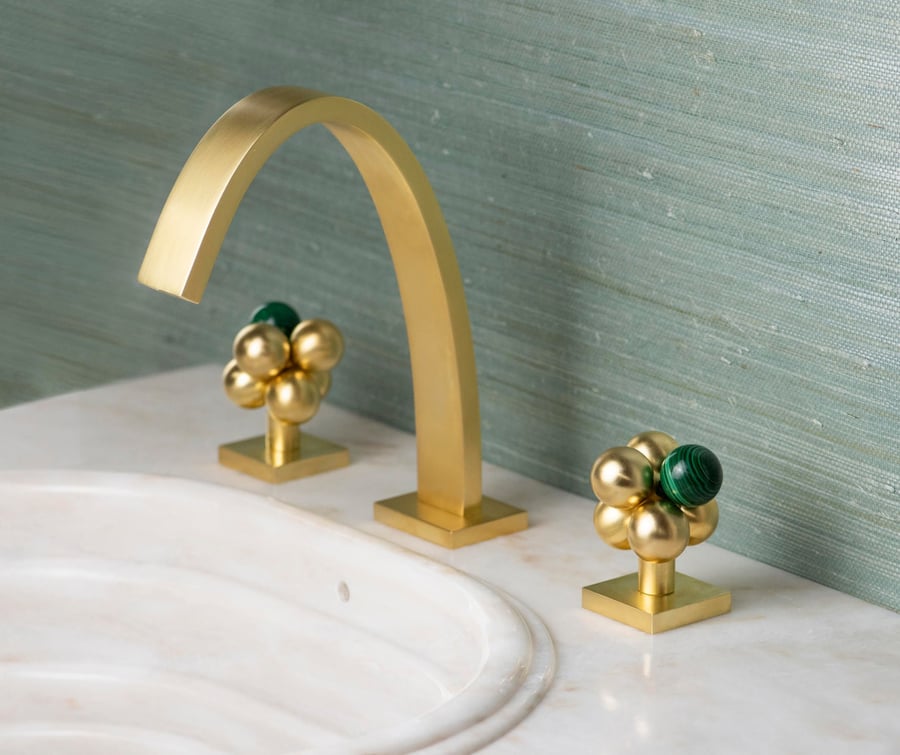 Luxurious Sherle Wagner Molecule Knob bathroom faucet set.