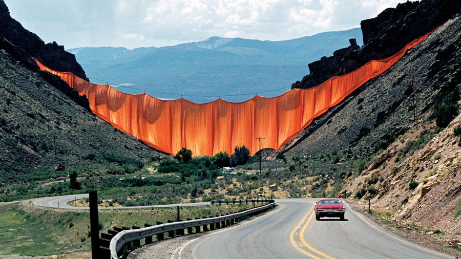 Huge orange curtain in a Colorado Canyon, strung up by Christo and Jeanne-Claude in the 1970s.