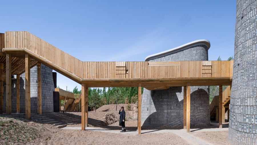 This wooden connecting bridge was installed between the retreat's guest pods to blur the line between public and private space.