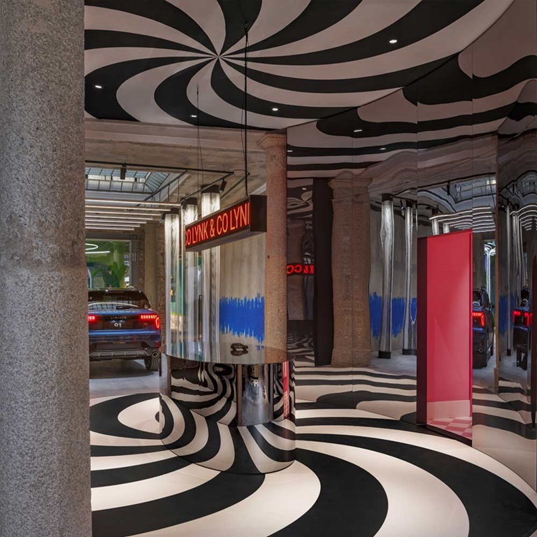 Black and white swirls coat the floor outside the Lynk & Co 01 hybrid vehicle display area.