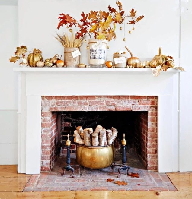 This super cozy fireplace is decked out in all sorts of fall trimmings.