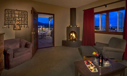 Many suites provide the warm ambiance of a wood burning kiva fireplace.
