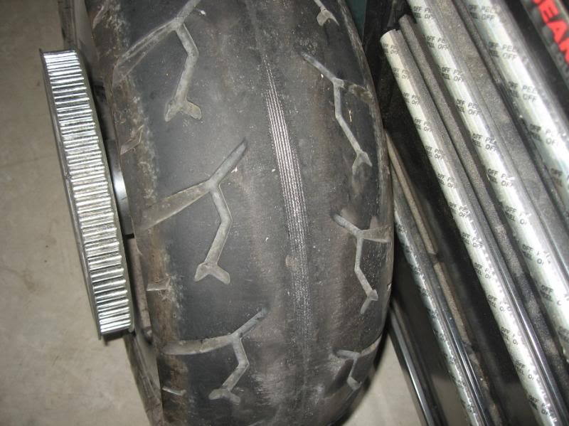 Tire worn to the structural cords