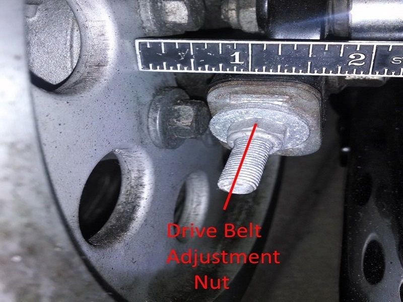 Drive belt adjustment bolt and nut