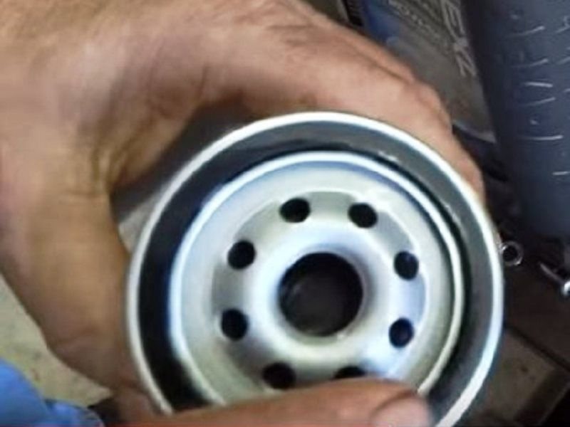 Pre-lubricate the oil filter gasket with fresh oil to prevent sticking and to maintain a good seal
