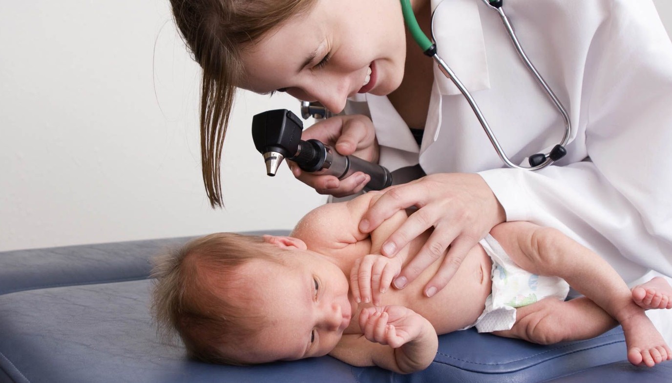 doctor examining baby