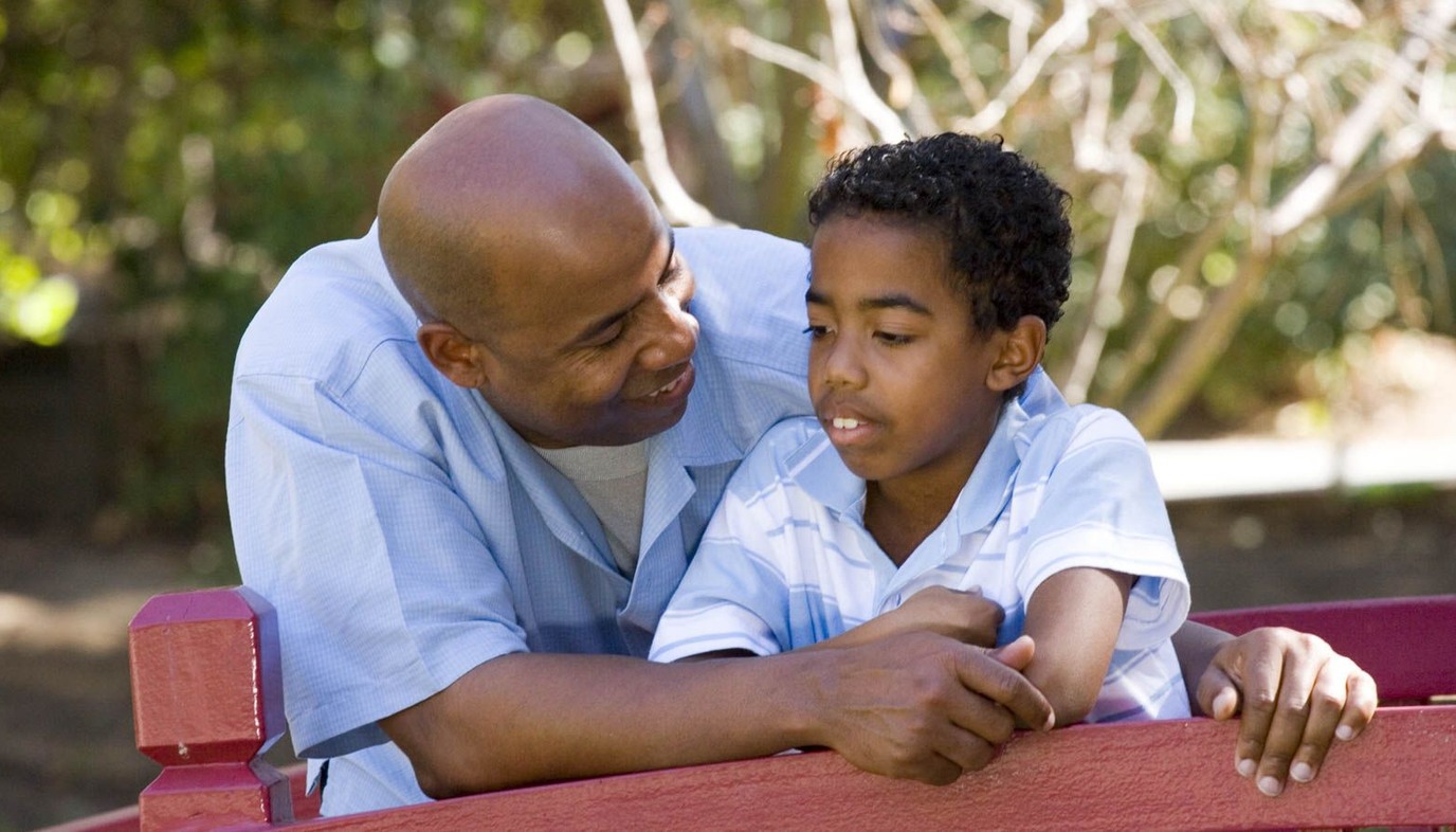 father talking to son