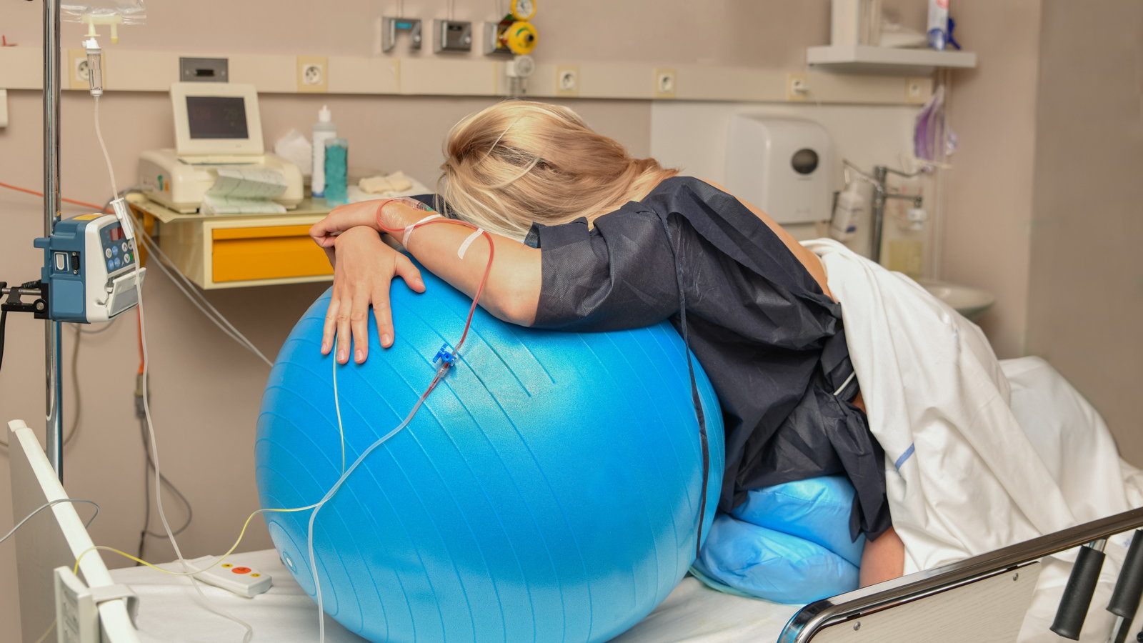 woman in labor using birth ball