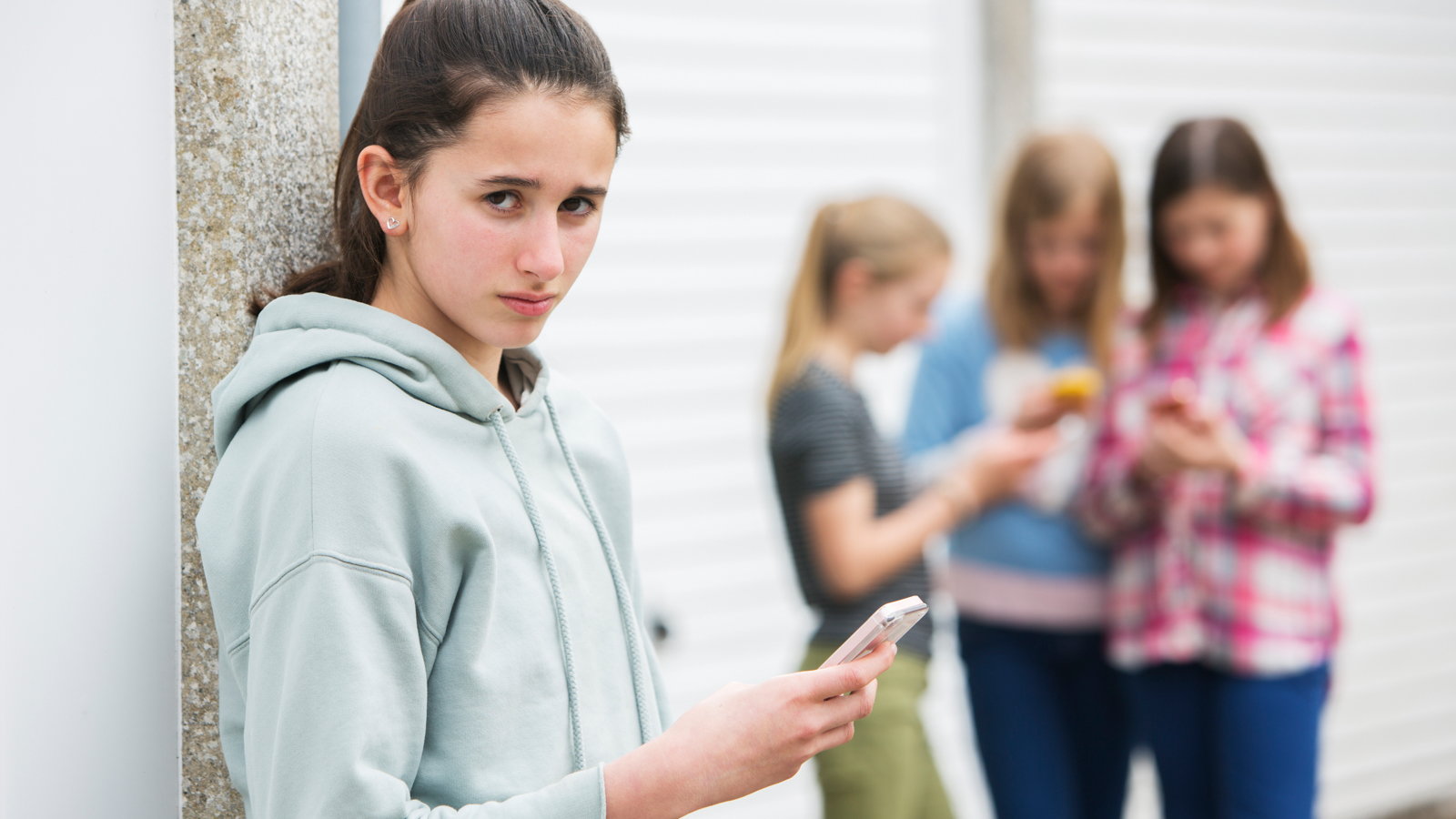teen being bullied by text messages
