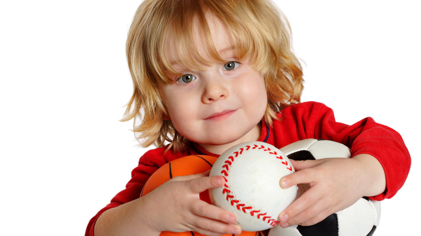 boy with softball, basketball, and soccer ball