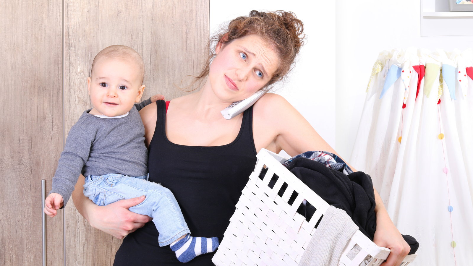 mom and child doing laundry