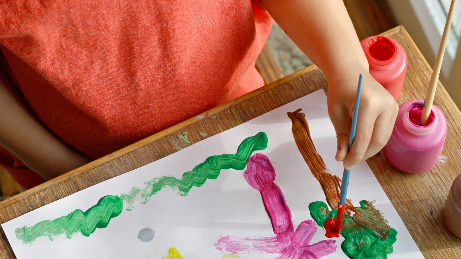 child painting picture