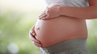 hands on pregnant belly 27 weeks pregnant your pregnancy week by week