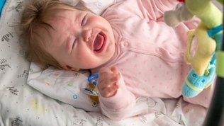 baby with handkerchief 5 tips for dealing with nasal congestion in babies