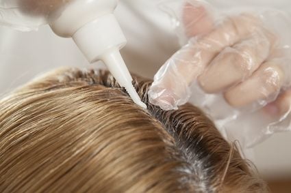 applying hair dye to scalp