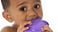 baby chewing on purple toy
