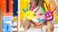child at preschool with finger paint on her hands