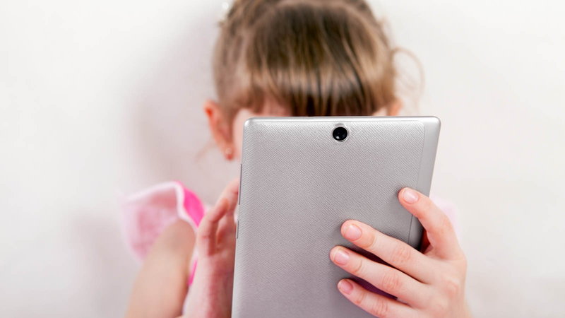 girl looking at tablet
