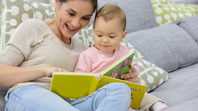 mom reading to baby