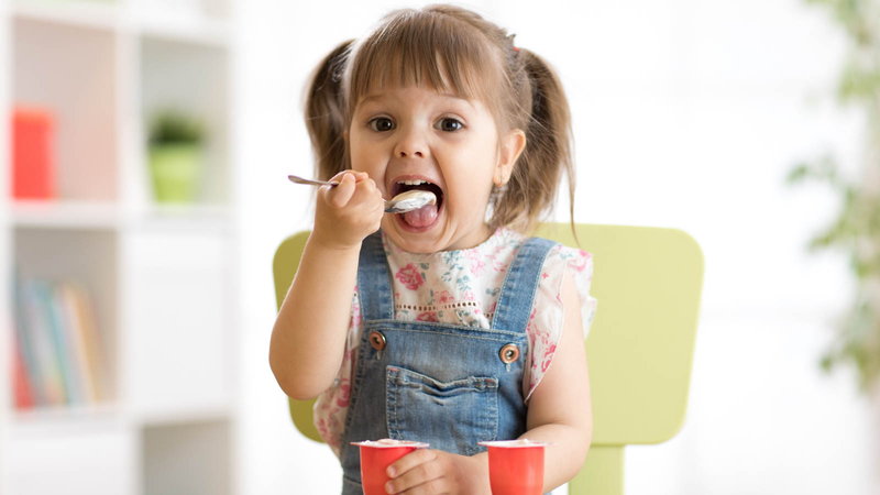 girl eating yogurt