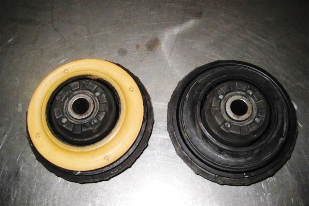 Old rubber isolator (right) versus new design urethane and metal (left)