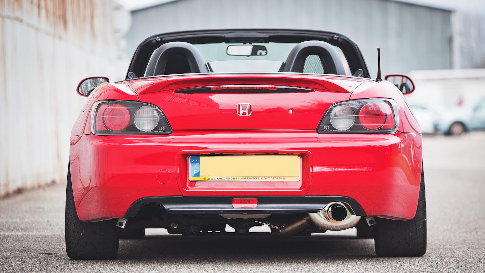 A fastback style Honda S2000 not gonna lie i think it looks amazing  especially in a black and white body with that engine bay stuffed full of  red chrome accents 👌 Fully