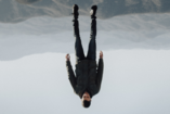 man levitating upside down