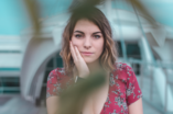 woman holding face
