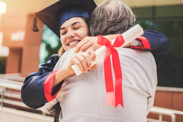 recovery school graduate hugging parent