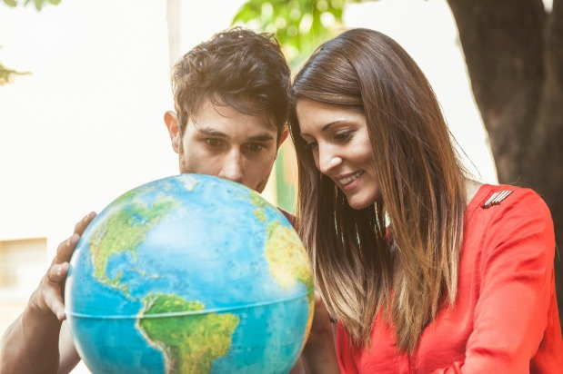 couple looking at globe