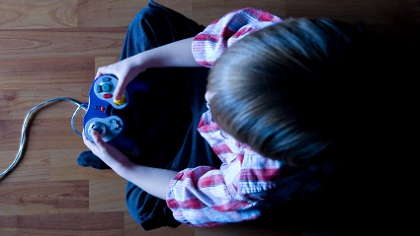 A boy playing a video game.