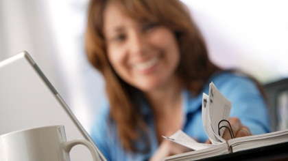 A woman examining her schedule planner.