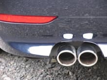 Exhaust and rear reflector