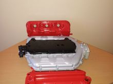 Super mirror red valve covers, gloss black top plate and also refinished the strut tower brace in gloss black