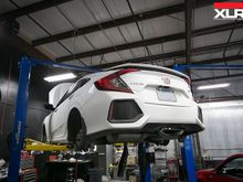 The Civic Si up on the lift being pulled apart for it's long list of upgrades. Ranging from suspension mods, to downpipes, and shifter mods.