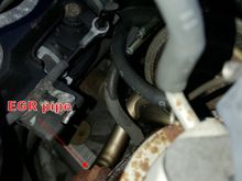 You can see a rubber hose from EGR valve. Disconnect that.