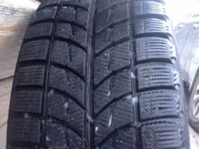Close up view of tire tread depth and tire pattern