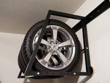 Wheels stored on tire rack